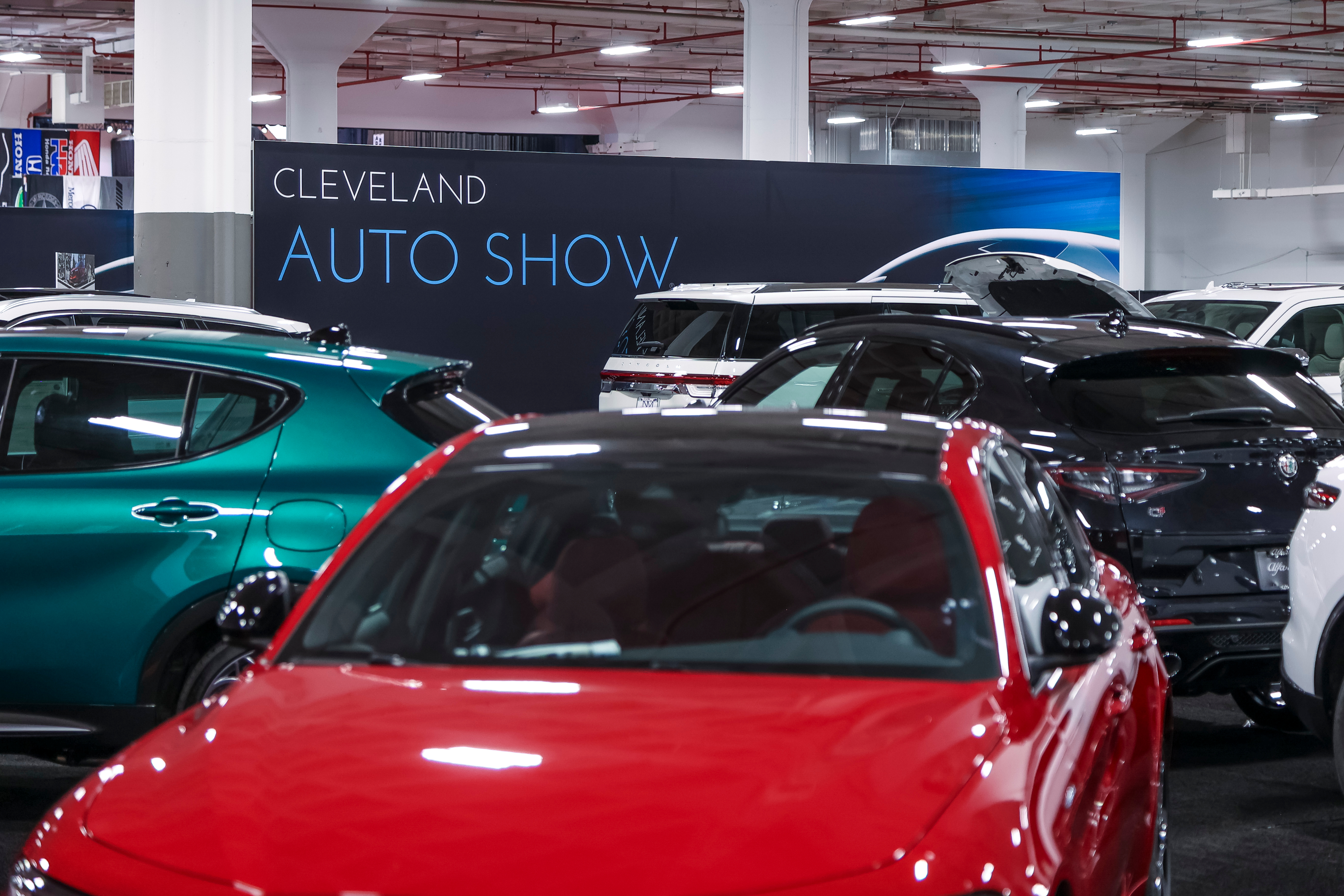 Image of a parking with the cleveland auto show banner